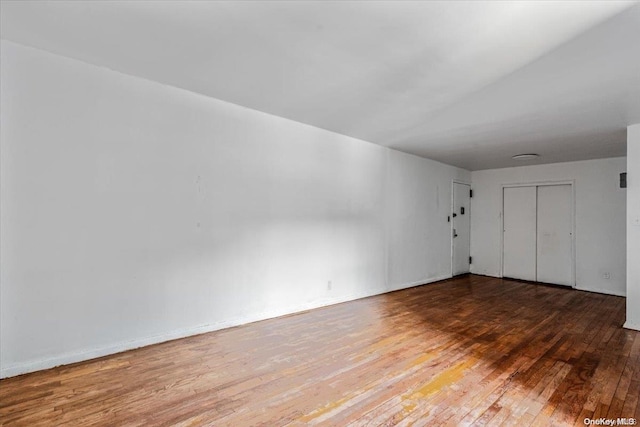 empty room with wood-type flooring