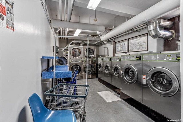 laundry room with washing machine and dryer and stacked washer and dryer