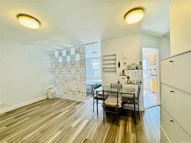 dining room with light wood-type flooring