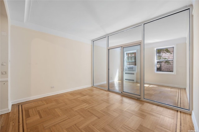 unfurnished bedroom with light parquet floors