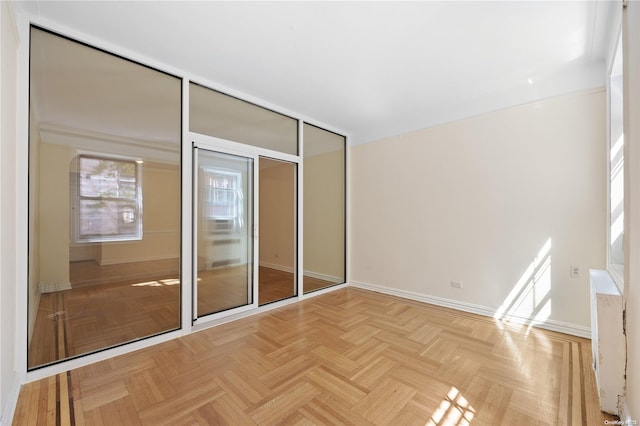 unfurnished bedroom featuring light parquet floors