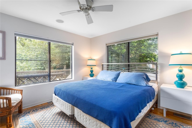 bedroom featuring hardwood / wood-style floors and ceiling fan