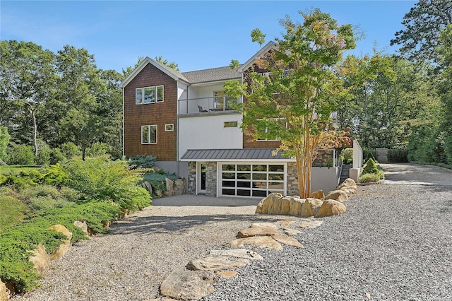 view of front of home featuring a balcony