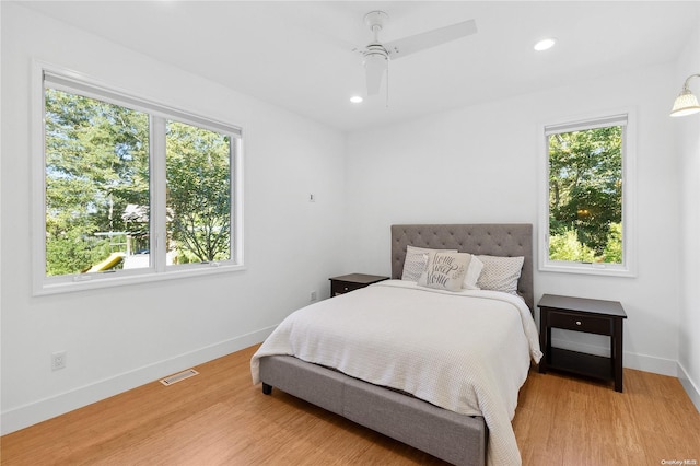 bedroom featuring ceiling fan and hardwood / wood-style floors