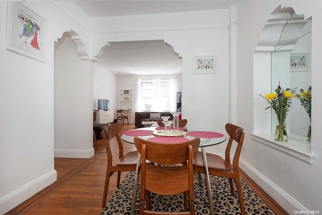 dining area with dark hardwood / wood-style floors