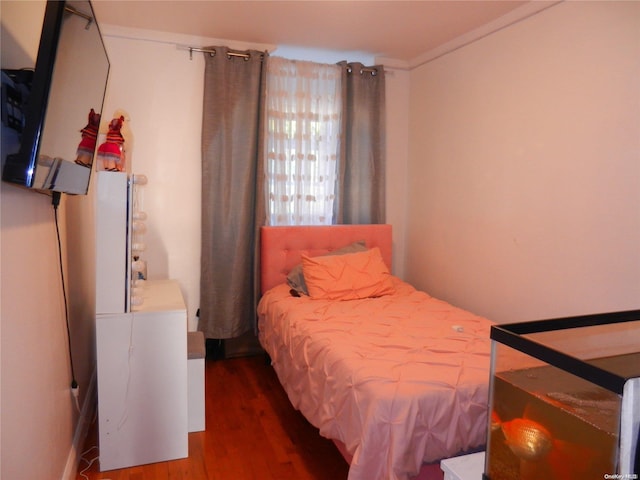 bedroom featuring dark wood-type flooring