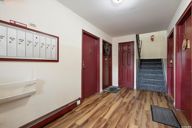 interior space with light hardwood / wood-style floors and a mail area