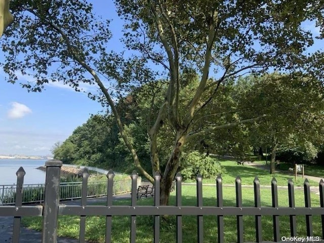 exterior space featuring a yard and a water view