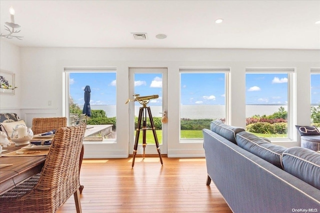 sunroom / solarium featuring plenty of natural light