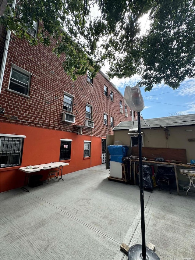 view of property exterior featuring a patio area