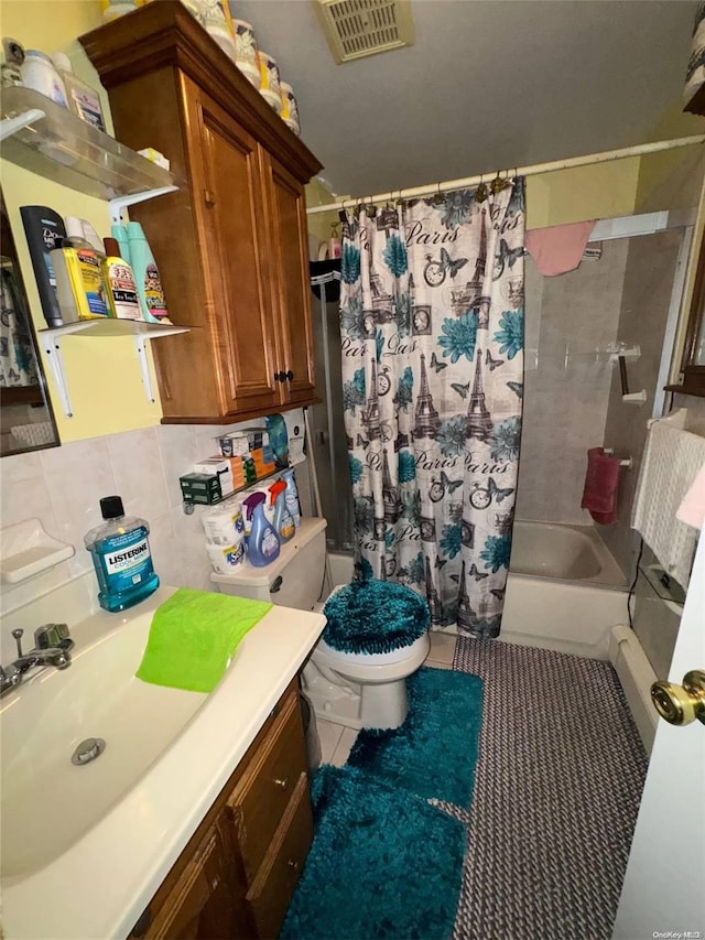 full bathroom featuring shower / bath combo, vanity, tile patterned flooring, toilet, and tasteful backsplash