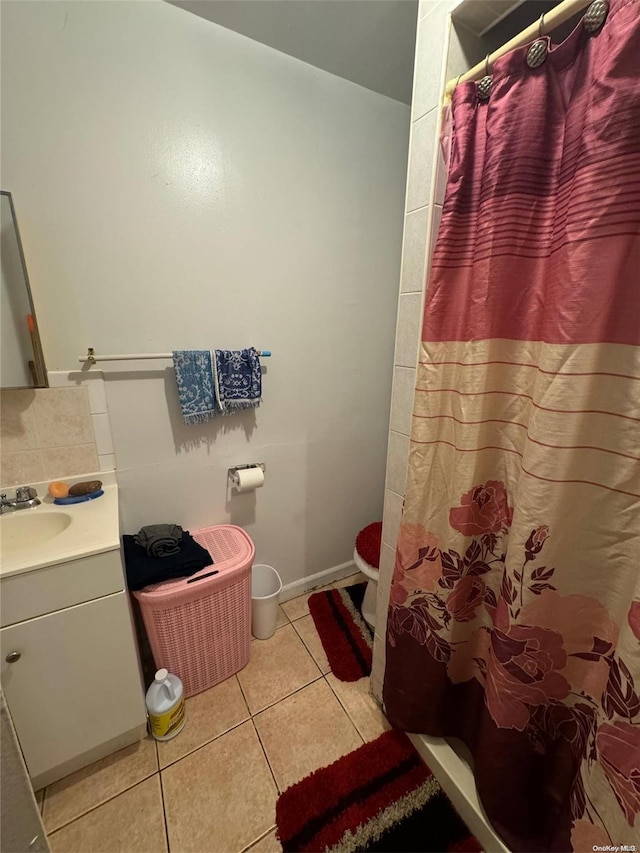 bathroom featuring tile patterned flooring and vanity