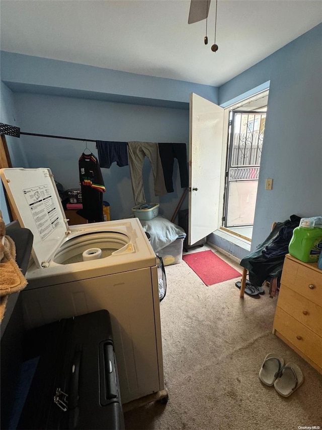 laundry room with ceiling fan, washer / dryer, and carpet floors