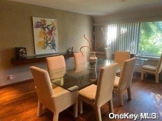 dining area with hardwood / wood-style floors