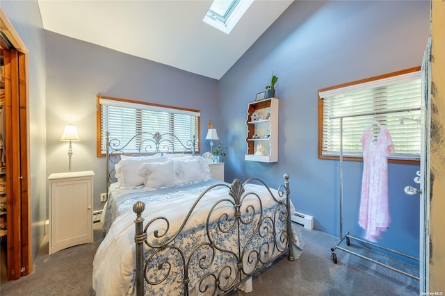 carpeted bedroom featuring baseboard heating and vaulted ceiling with skylight