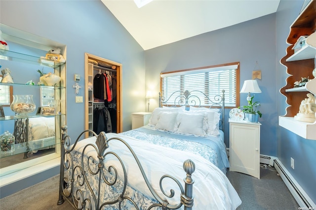 bedroom with a closet, vaulted ceiling, dark carpet, and a baseboard heating unit