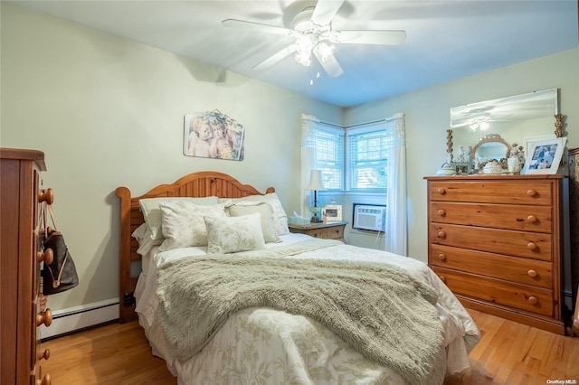 bedroom featuring baseboard heating, ceiling fan, and light hardwood / wood-style flooring