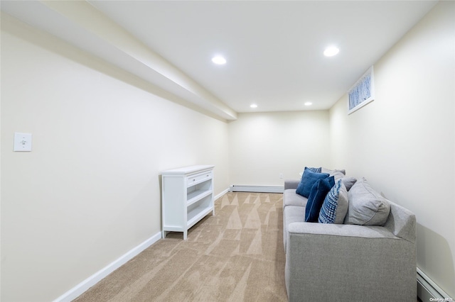 living area with light colored carpet and baseboard heating