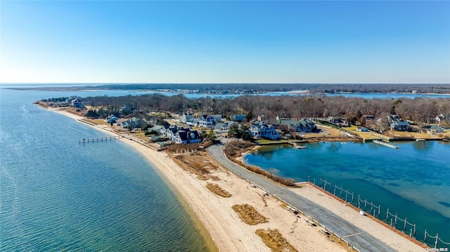 bird's eye view featuring a water view and a view of the beach