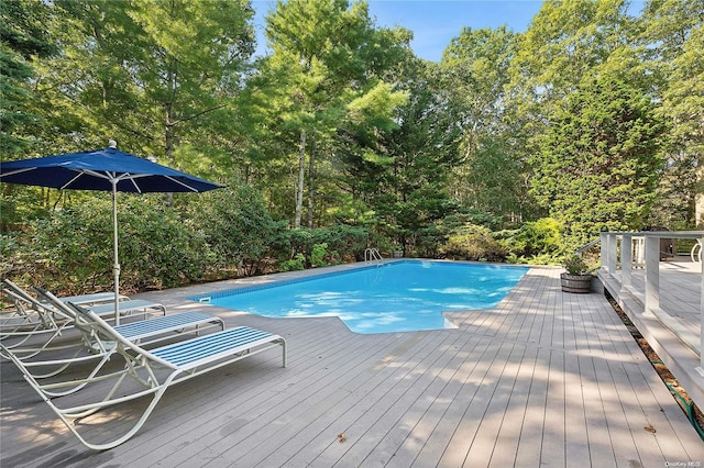 view of swimming pool with a deck