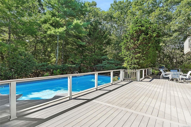 view of pool featuring a wooden deck