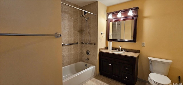 full bathroom featuring tile patterned flooring, vanity, tiled shower / bath combo, and toilet