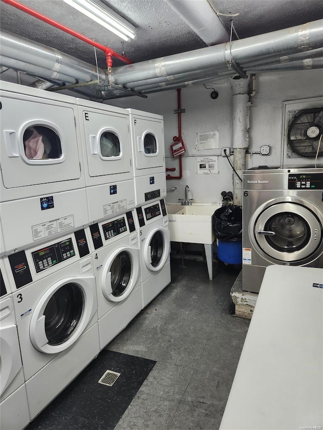 washroom with washer and dryer and stacked washer and clothes dryer