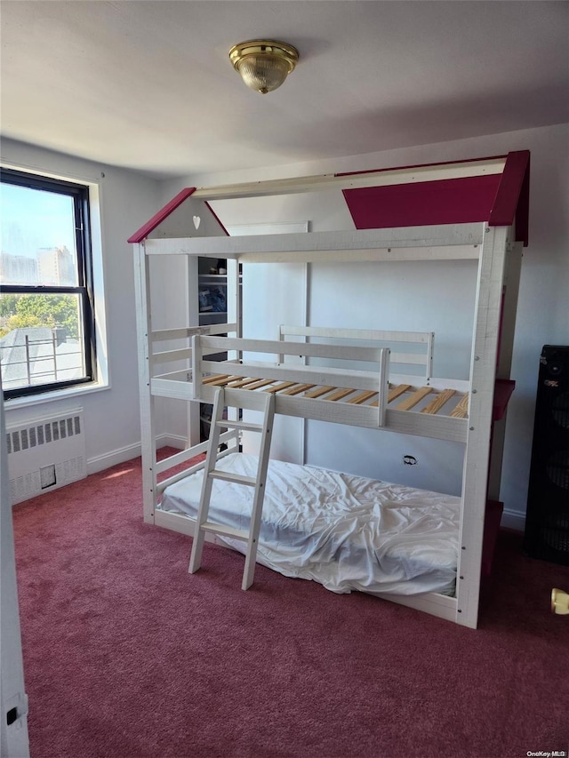 bedroom featuring carpet flooring and radiator heating unit