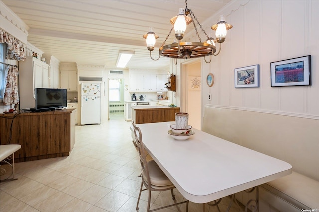 dining space with a notable chandelier