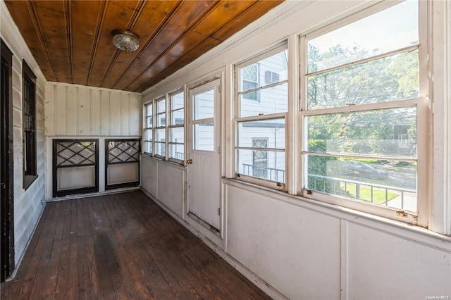 unfurnished sunroom featuring plenty of natural light and wooden ceiling