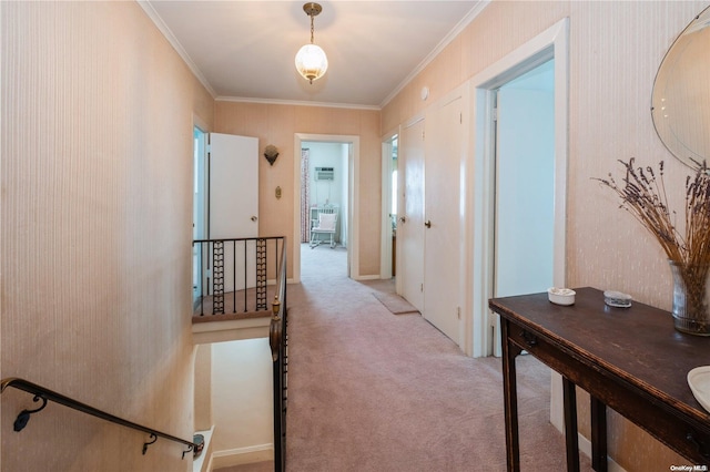 hallway with crown molding and light carpet