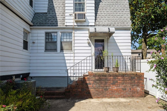 entrance to property featuring central AC unit