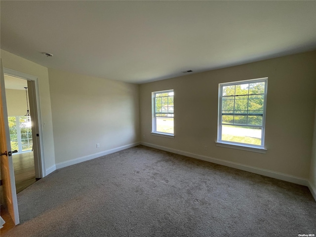 empty room featuring carpet flooring