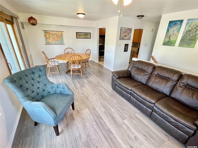 living room with light hardwood / wood-style flooring