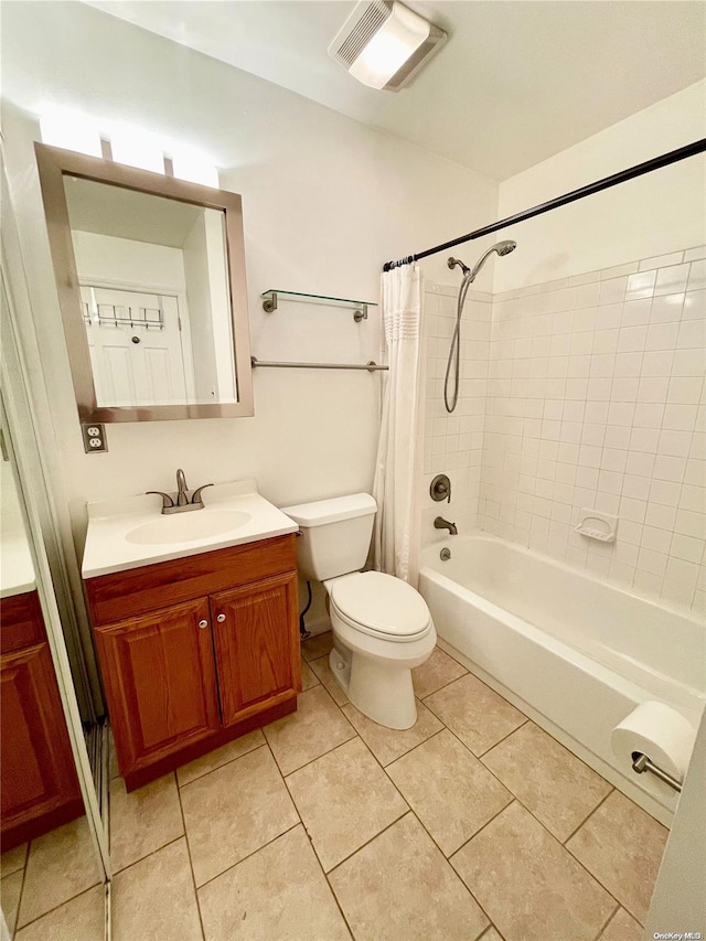 full bathroom featuring tile patterned flooring, shower / tub combo, vanity, and toilet