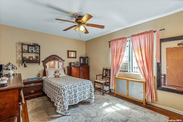 bedroom featuring ceiling fan and wood-type flooring