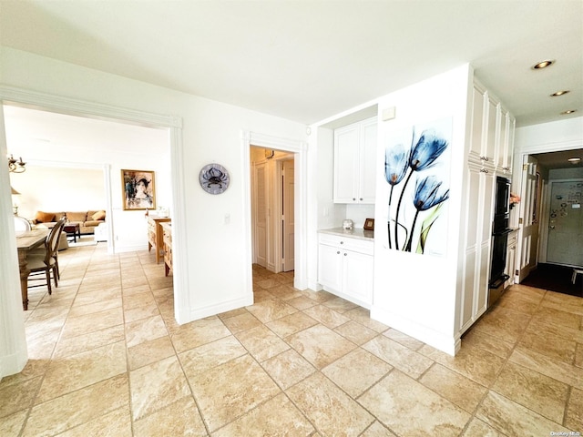 kitchen featuring white cabinetry