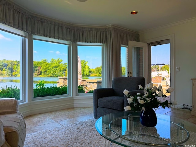 sunroom / solarium featuring a water view and plenty of natural light