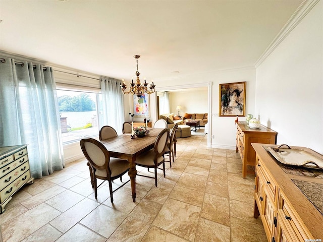 dining space featuring a notable chandelier and ornamental molding