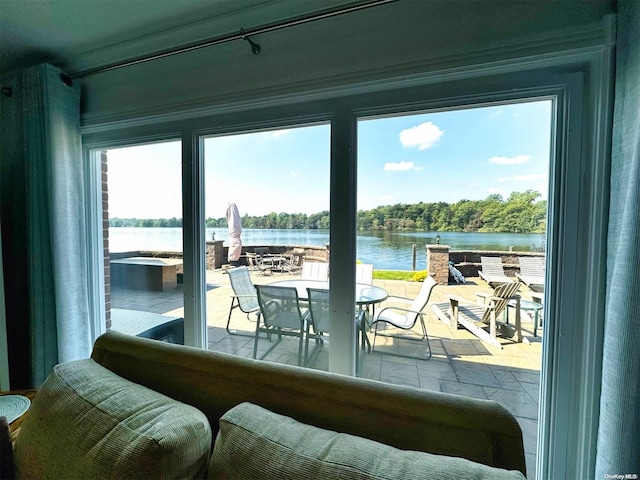 entryway with a wealth of natural light and a water view