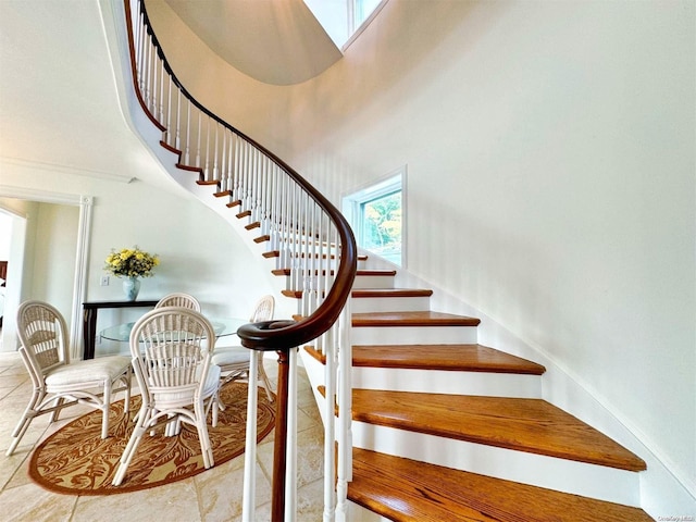 staircase with a high ceiling