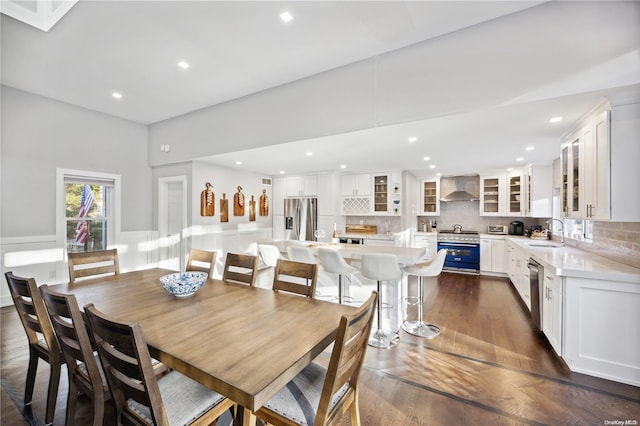 dining area with sink and dark wood-type flooring