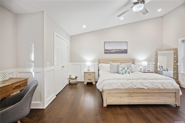 bedroom featuring ceiling fan, dark wood-type flooring, and lofted ceiling