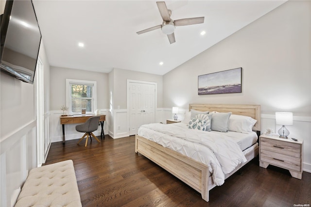 bedroom with ceiling fan, vaulted ceiling, dark hardwood / wood-style flooring, and a closet