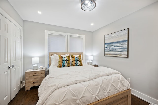 bedroom featuring dark hardwood / wood-style flooring and a closet