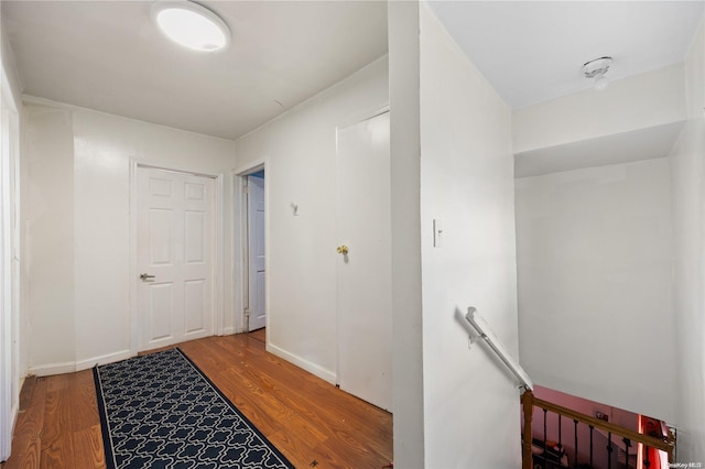 hallway with wood-type flooring