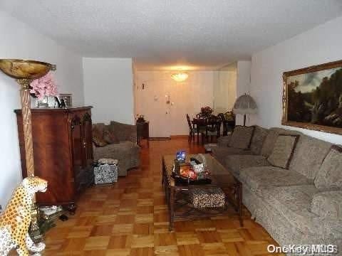 living room with parquet flooring