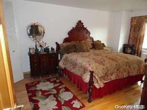 bedroom featuring wood-type flooring