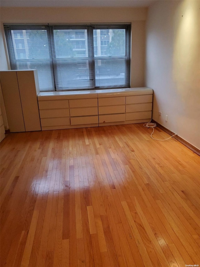 spare room with light hardwood / wood-style floors