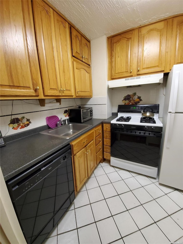 kitchen with decorative backsplash, white appliances, sink, and light tile patterned floors